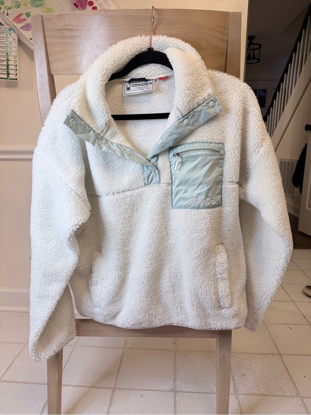 Spyder womens Cream Sherpa Pullover with Mint Accent Pocket